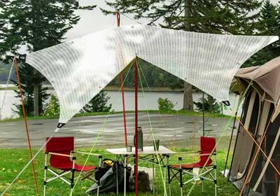 Stack of durable tarpaulins available at Tarps UK Online in different sizes and colours