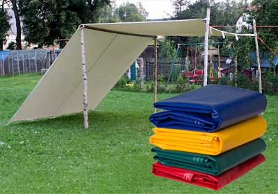 Different types of tarpaulins stacked for sale at Tarps UK Online